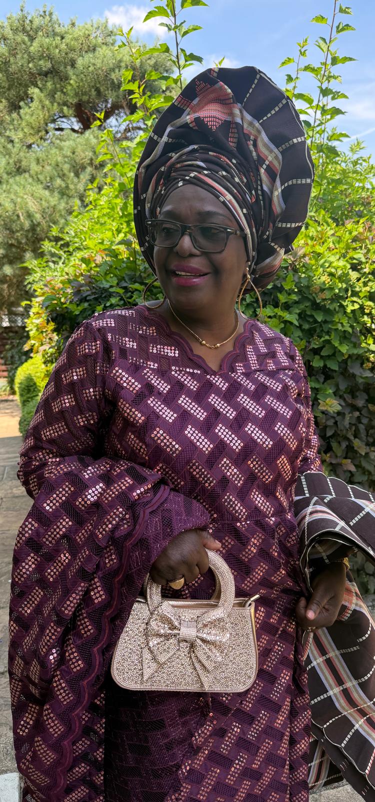 Guest in traditional gele — Love & Tyron wedding