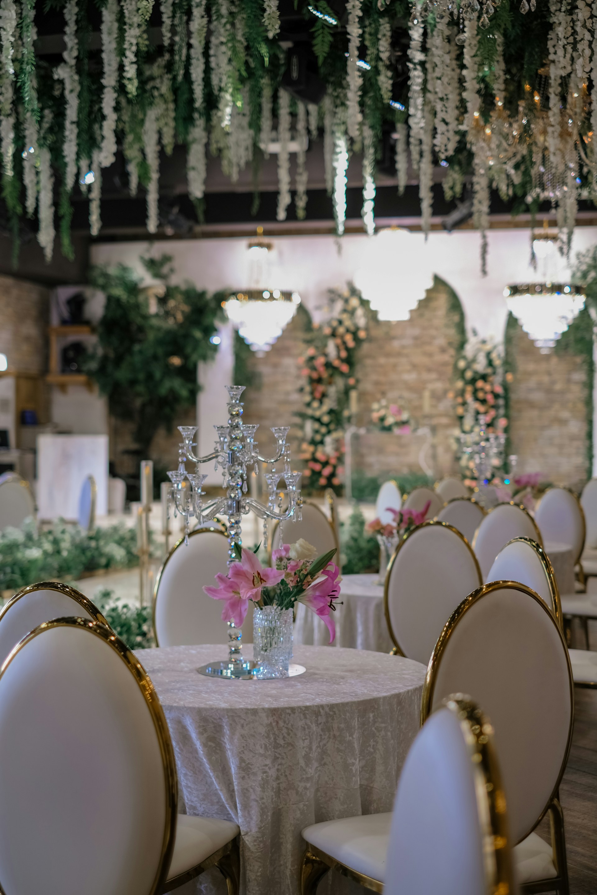 Luxury venue with hanging florals and candelabras